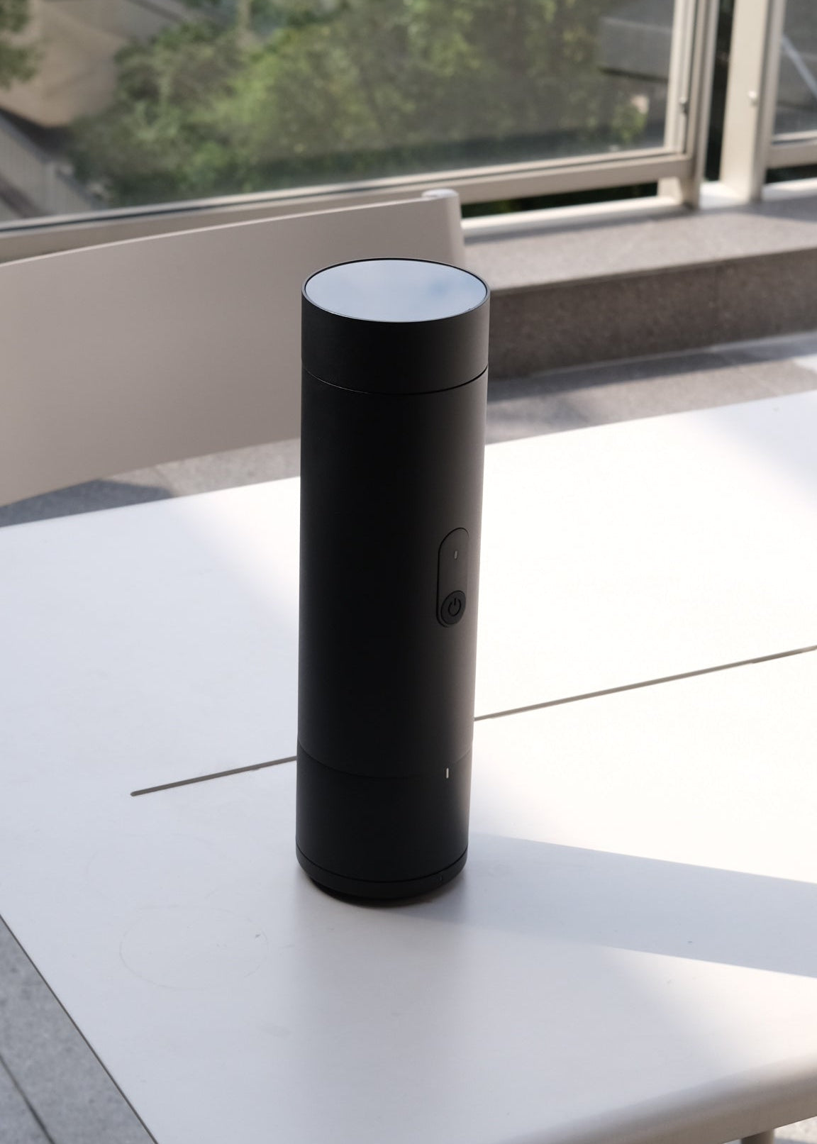 ORBI Portable brewer and cup shown separately
