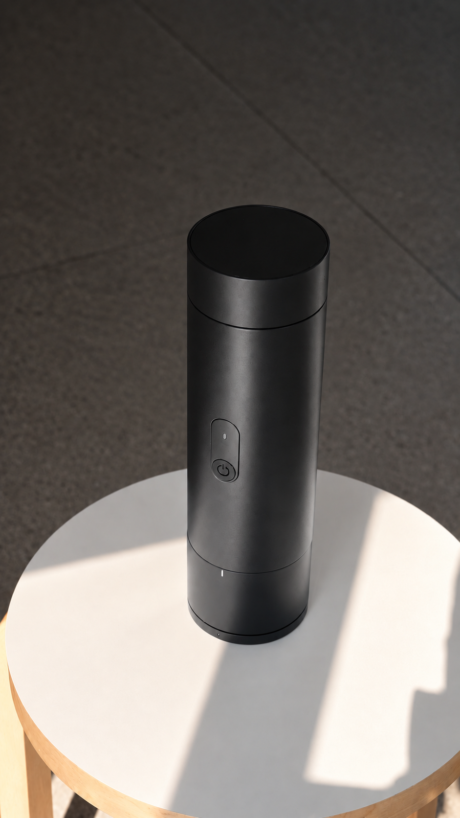 Black ORBI Portable with its cup attached