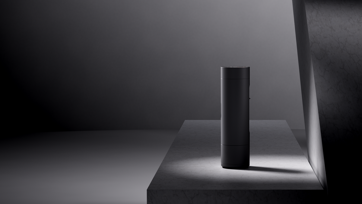 Black ORBI Portable standing on a stone ledge in directional light