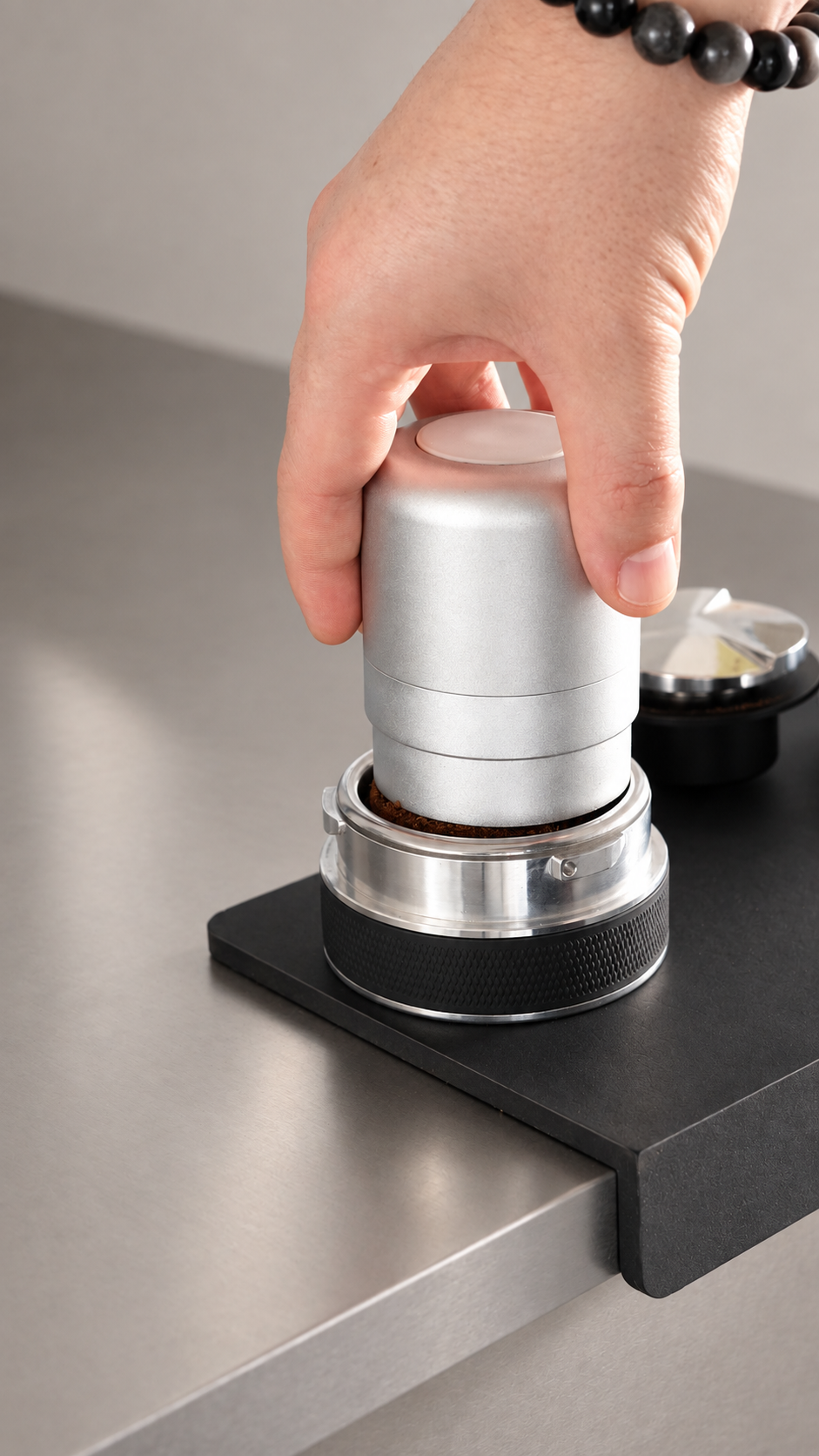 Preparing coffee in the ORBI espresso basket with the distributor