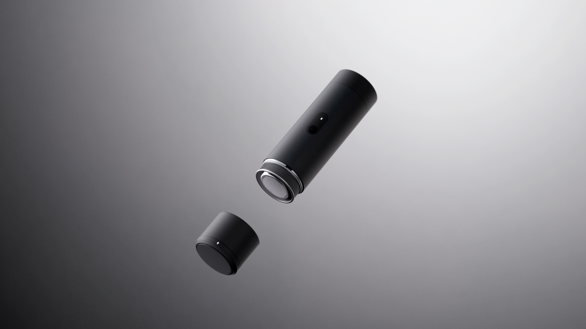 Black ORBI Portable standing on a stone ledge in directional light