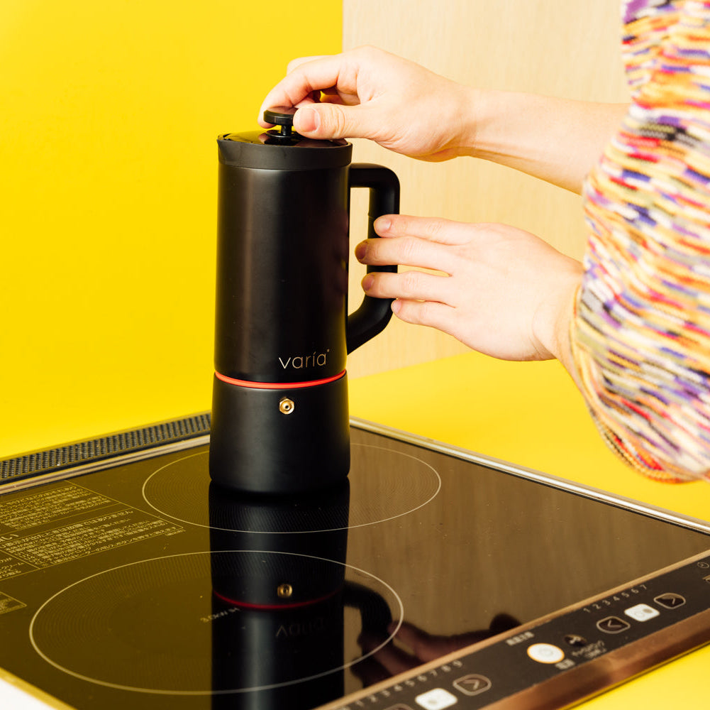 Black Varia PRO Moka heating on an induction hob